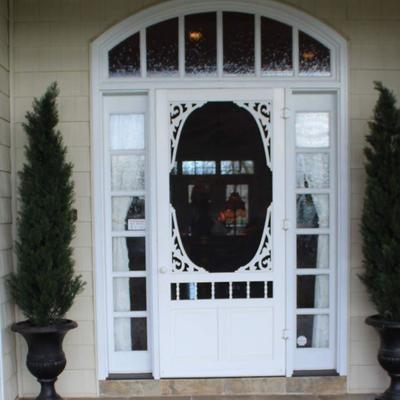 2 evergreens and urns