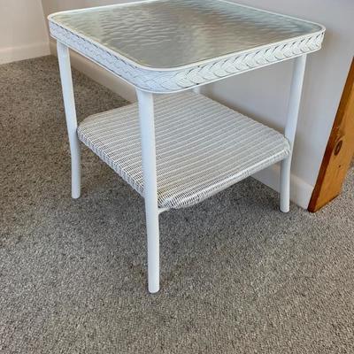Small white wicker table with glass top