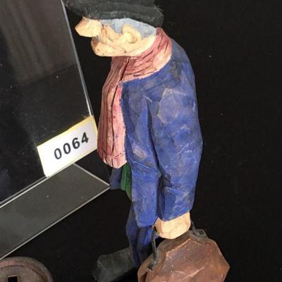 3 toy miniature cast iron skillets and a carved doctor or carpetbagger - you decide :o)