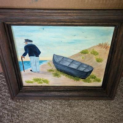 Old man with boat framed