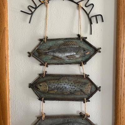 Welcome sign with 3 wooden fish