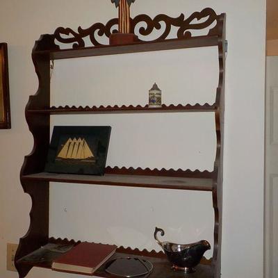Hanging solid wood book or nic/nac shelve with articulate scroll design.