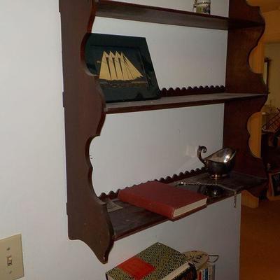 Hanging solid wood book or nic/nac shelve with articulate scroll design.