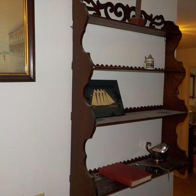 Hanging solid wood book or nic/nac shelve with articulate scroll design.