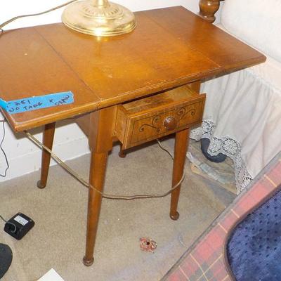 Vintage night stand with fold down .