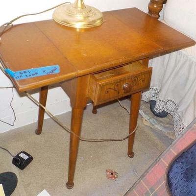 Vintage night stand with fold down .
