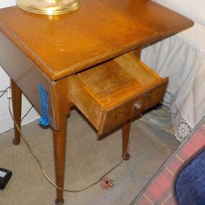 Vintage night stand with fold down .