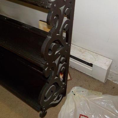 Hanging solid wood book or nic/nac shelve with articulate scroll design.