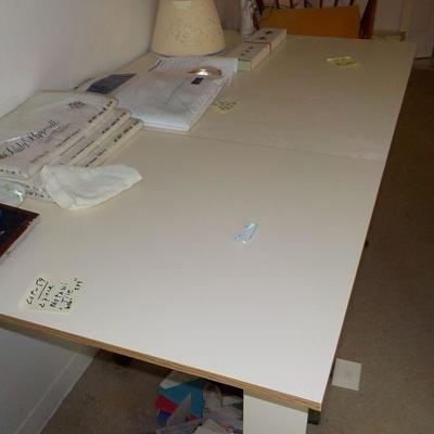 Fold up craft table with fold down sizes and wheels.