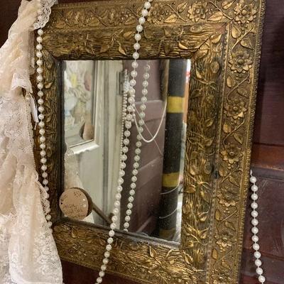 Antique guided gold framed mirror 