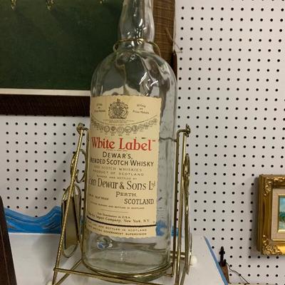 Dewarâ€™s white label whiskey bottle w/stand 