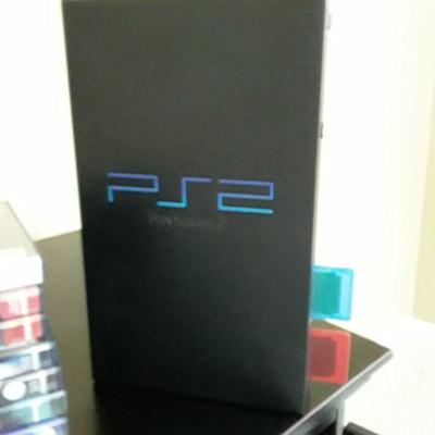 LOT: PS2 fat console; two controllers; 9 games