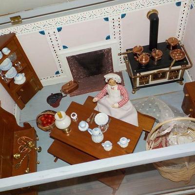 Miniature doll house with case.
