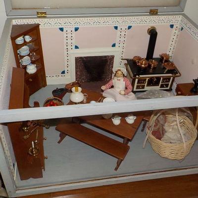 Miniature doll house with case.