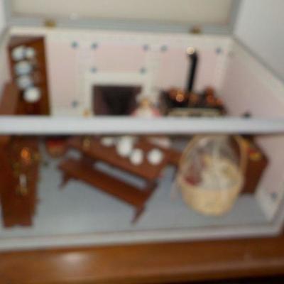 Miniature doll house with case.