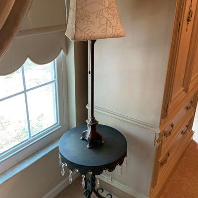 Metal table with hanging crystals and lamp