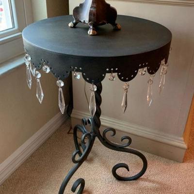 Metal table with hanging crystals and lamp