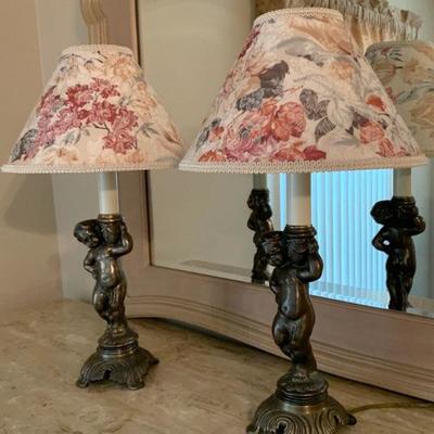 Two matching cherub lamps
