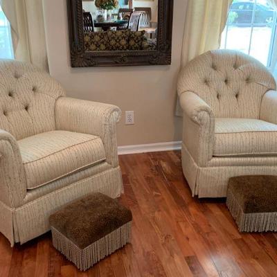 Two Matching Haverty's Rocker Swivel Side Chairs with foot stools and wall mirror