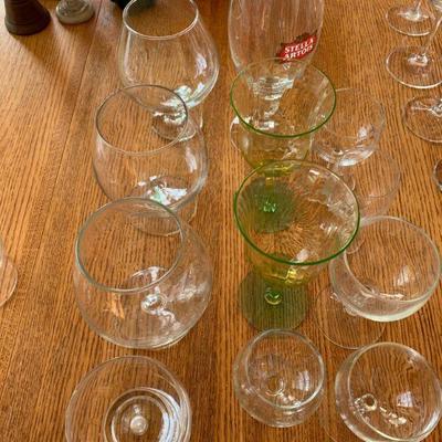 Table full of glassware , barware and other