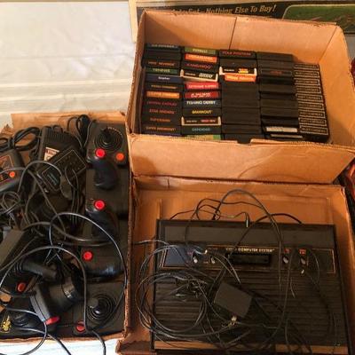 Vintage Atari Lot, System with Over 55 Games, 9 CXL Cartridges, 12 Controllers and Pads, and Power Cables