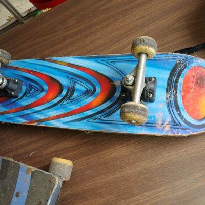 lot skate boards and helmets