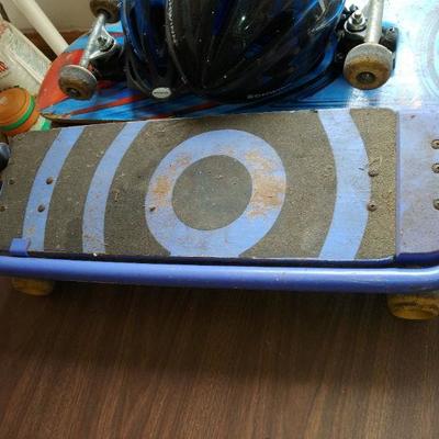 lot skate boards and helmets