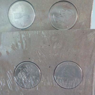 2 Sets of state quarters, non-circulated Maryland and South Carolina.