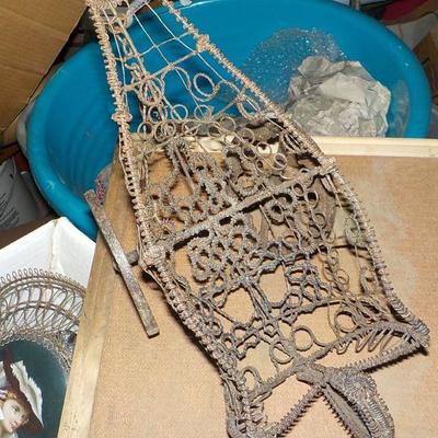 Late 1800's wire art bottle holder.