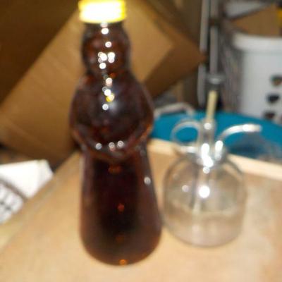 Vintage containers " Maple Syrup and 1900's hand pump hand sprayer.