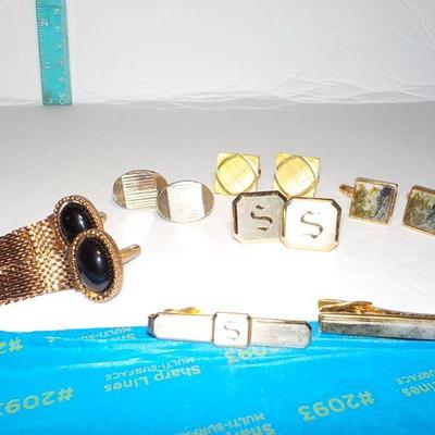 5 sets of mens cuff links and tie clasps.