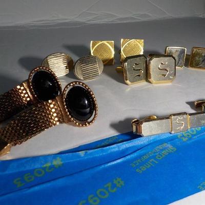 5 sets of mens cuff links and tie clasps.