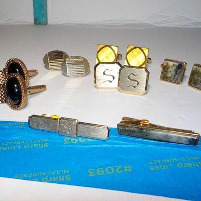 5 sets of mens cuff links and tie clasps.
