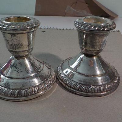 3 in. x 3 in sterling candle holders.