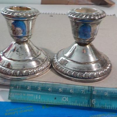 3 in. x 3 in sterling candle holders.