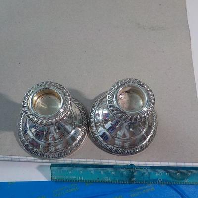 3 in. x 3 in sterling candle holders.