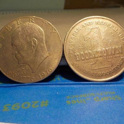Eisenhower Centennial dollar and a BOOM TOWN Token.
