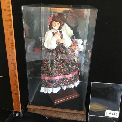 Simpich Doll - Flower Girl - holding a flower to her nose with a basket of flowers