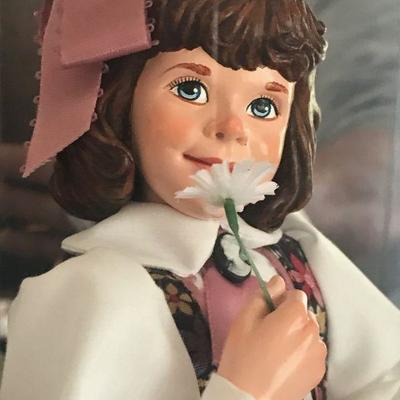 Simpich Doll - Flower Girl - holding a flower to her nose with a basket of flowers