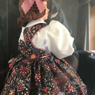 Simpich Doll - Flower Girl - holding a flower to her nose with a basket of flowers