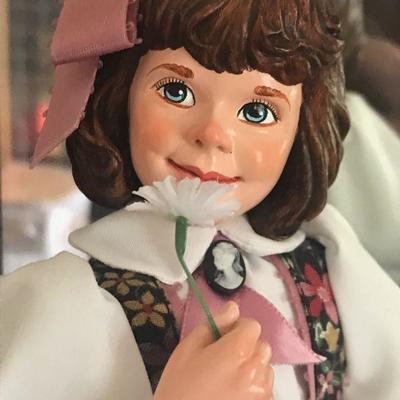 Simpich Doll - Flower Girl - holding a flower to her nose with a basket of flowers