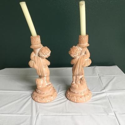 F-103 Pair of cherub terra-cotta candlesticks