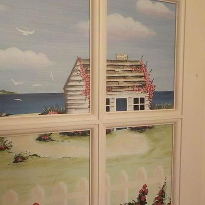 Wood art window with pic. of sea side .