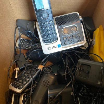 Box of old phones with chords