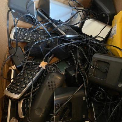 Box of old phones with chords