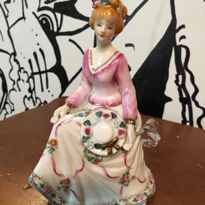 Sitting lady figurine