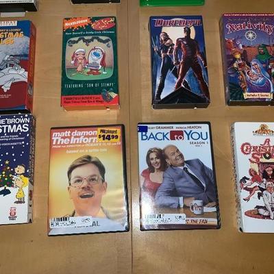 Assortment of 10 VHS Tapes and 2 DVDâ€™s