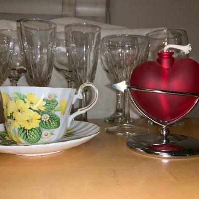 Assortment of Items Wine Glasses Teacup And Saucer