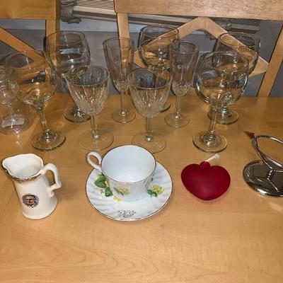 Assortment of Items Wine Glasses Teacup And Saucer