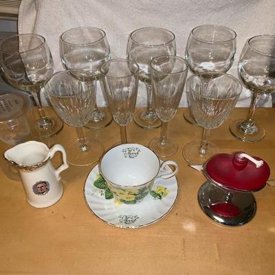 Assortment of Items Wine Glasses Teacup And Saucer